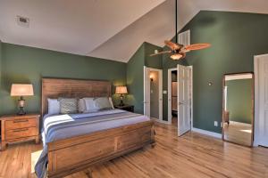 a bedroom with a bed and a ceiling fan at Lake Hartwell Retreat with Boat Dock and Kayaks! in Fair Play