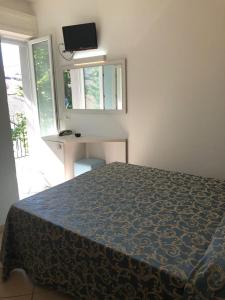 Postel nebo postele na pokoji v ubytování Hotel Mirabella