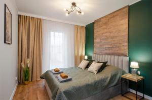 Postel nebo postele na pokoji v ubytování East Side Apartments