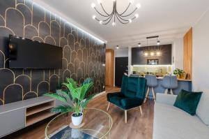 TV a/nebo společenská místnost v ubytování East Side Apartments
