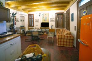 a kitchen and living room with a table and chairs at Kleopatra's House in Karavostamo