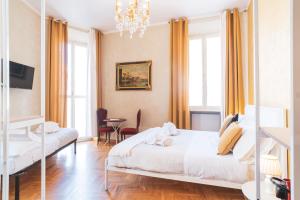 Säng eller sängar i ett rum på Golden Rooms Piazza di Spagna