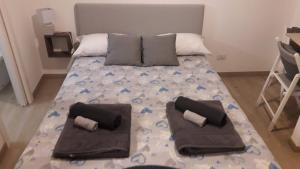 Posteľ alebo postele v izbe v ubytovaní RomAmoR Campo de' fiori