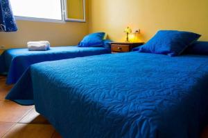 Giường trong phòng chung tại 16:9 Villa Agua Amarga +7 ảnh