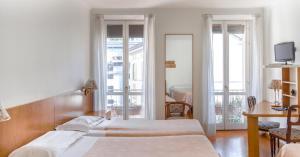 Postel nebo postele na pokoji v ubytování Hotel Tre Re