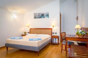 Postel nebo postele na pokoji v ubytování Hotel Tre Re