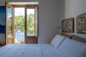 Postel nebo postele na pokoji v ubytování Iancura - B&B di design a Salina