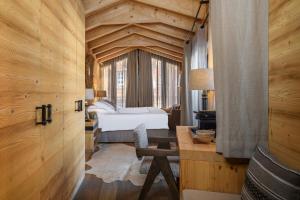 Postel nebo postele na pokoji v ubytování Unique Hotel Post