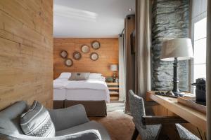 Postel nebo postele na pokoji v ubytování Unique Hotel Post