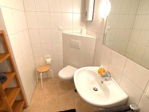 a bathroom with a sink and a toilet at Stylisches Apartment ✰ SKYWALK ✰ mit Parkplatz in Willingen +9 photos