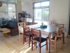 a living room with a wooden table and chairs at Miyakojima - House - Vacation STAY 22179v in Uechi