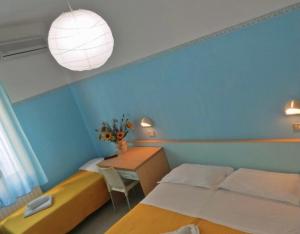 Postel nebo postele na pokoji v ubytování Hotel Silvana Beach