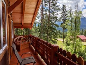 a porch with chairs and a view of the mountains at Tschurtschenthaler Rentals in Golden