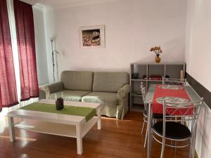 a living room with a couch and a table at Sofia in Santa Úrsula