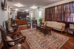 a living room with a couch and a table at Shangri-La Springs in Bonita Springs