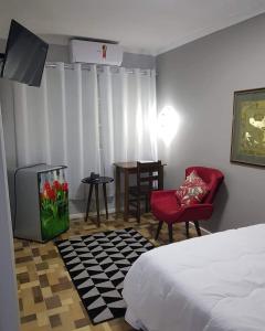Uma área de estar em HOTEL CATARINA BAURU
