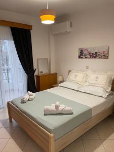 Posteľ alebo postele v izbe v ubytovaní The Gemini Suites
