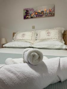 Posteľ alebo postele v izbe v ubytovaní The Gemini Suites