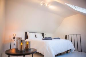 Кровать или кровати в номере Huis ALNA 1