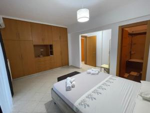 Posteľ alebo postele v izbe v ubytovaní The Gemini Suites