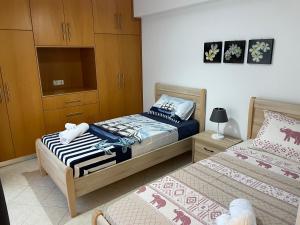 Posteľ alebo postele v izbe v ubytovaní The Gemini Suites