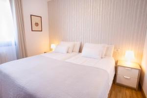 Ένα ή περισσότερα κρεβάτια σε δωμάτιο στο Apartamento A Laxe