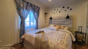 a bedroom with a large bed and a window at Adorable modern guesthouse with full kitchen in Encino