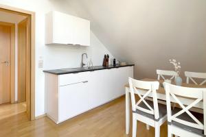 Kuchyň nebo kuchyňský kout v ubytování Apartment mit Dachterrasse & Sauna
