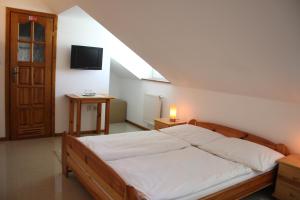 Posteľ alebo postele v izbe v ubytovaní Sabbia Ristorante - Reštaurácia a Ubytovanie Prievidza