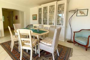 a dining room with a table and chairs at villa for 10 people with private pool 250m from the sea in Saint-Aygulf