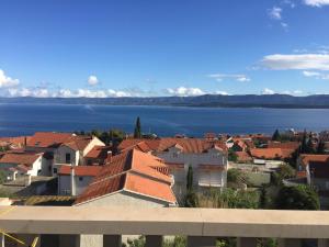 a view of a city and the water at Villa Berlin in Bol