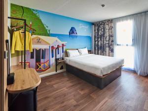 Postel nebo postele na pokoji v ubytování B&B HOTEL Fort-de-France