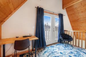 Postel nebo postele na pokoji v ubytování Summit Chalet