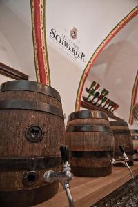 two wooden barrels sitting on a counter in front of a mirror at Schwerter Schankhaus & Hotel in Meißen