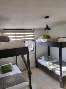 Ένα ή περισσότερα κρεβάτια σε δωμάτιο στο Hostal San Bernabé