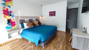 Postel nebo postele na pokoji v ubytování Hotel Aristo Gold