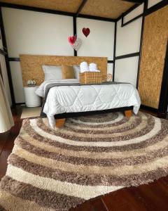 Postel nebo postele na pokoji v ubytování Balú Glamping