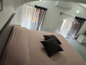 Posteľ alebo postele v izbe v ubytovaní Maya's Home