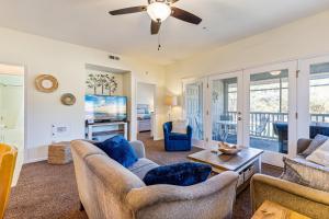 a living room with furniture and a ceiling fan at Tidewater Condos in North Myrtle Beach