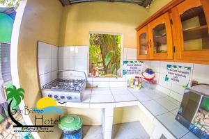 a model of a kitchen in a doll house at Sun Breeze Hotel in El Remate +43 photos