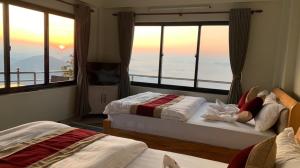 Katil atau katil-katil dalam bilik di Hotel Pristine Himalaya