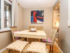 a small dining room with a table and chairs at 46 Trevithick Court in Hayle