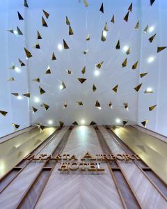 a bowling alley with black and gold pins at Jakarta Airport Hotel in Tangerang