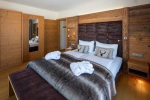 Ένα ή περισσότερα κρεβάτια σε δωμάτιο στο Berg & Golf Resort Westendorf by ALPS RESORTS