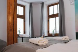 Postel nebo postele na pokoji v ubytování Hotel Petřín