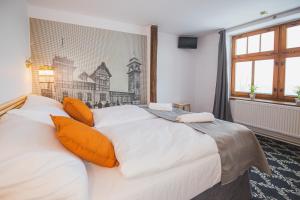 Postel nebo postele na pokoji v ubytování Hotel Petřín