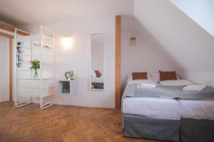 Postel nebo postele na pokoji v ubytování Hotel Petřín