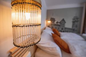 Postel nebo postele na pokoji v ubytování Hotel Petřín