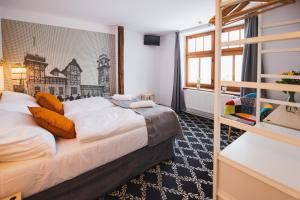 Postel nebo postele na pokoji v ubytování Hotel Petřín