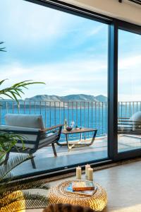 a living room with a view of the ocean at Born in Blue in Kaş